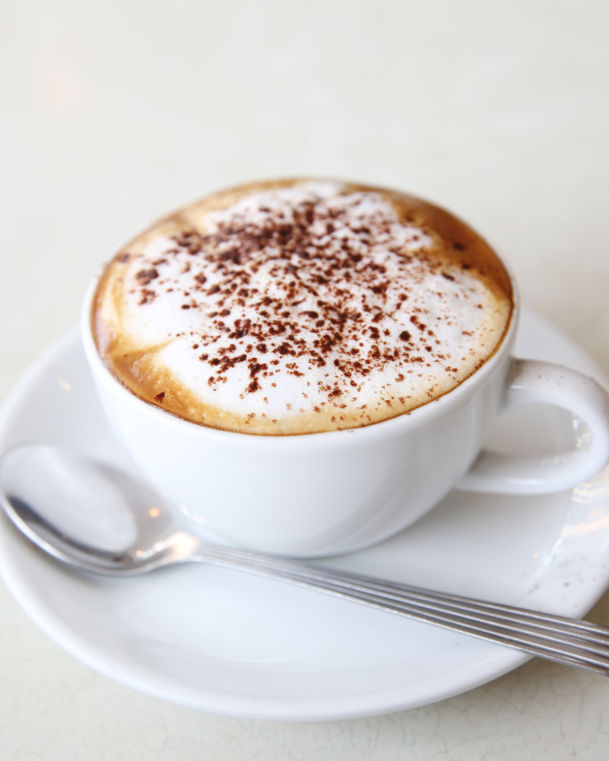 caffe latte vs cappuccino – traditional cappuccino with thick foam layer in ceramic cup