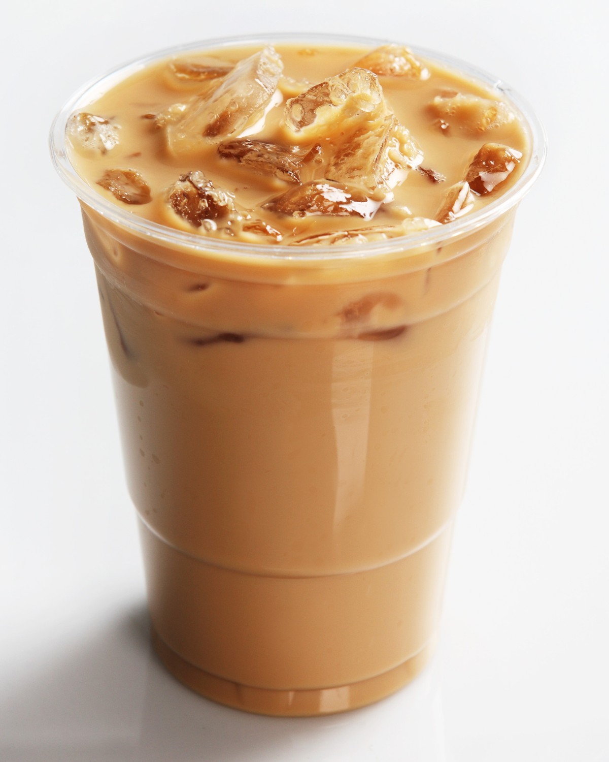 cold brew vs iced coffee – traditional iced coffee with cream swirl