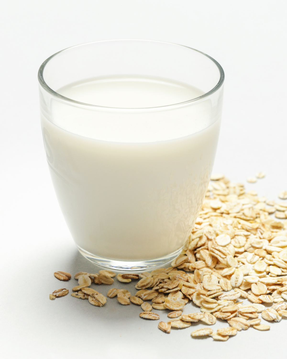 oat milk vs almond milk – two glasses of plant-based milk side by side