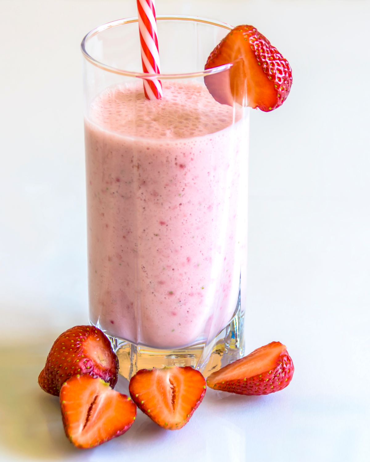 Protein shake vs smoothie comparison - colorful fruit smoothie in glass with fresh ingredients