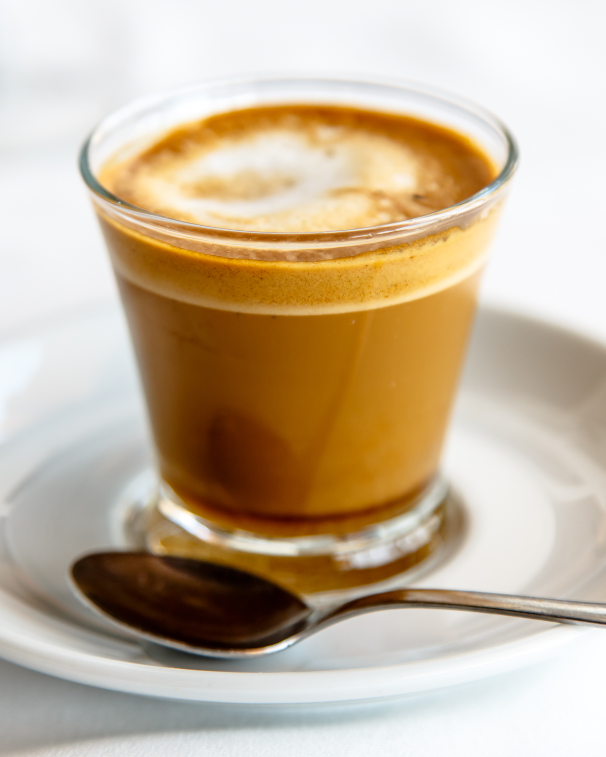 cortado vs flat white – cortado in small glass with equal espresso and steamed milk